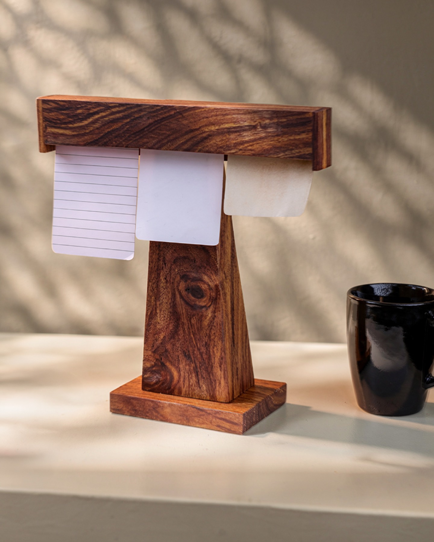 Display Dock in warm evening light beside a black mug